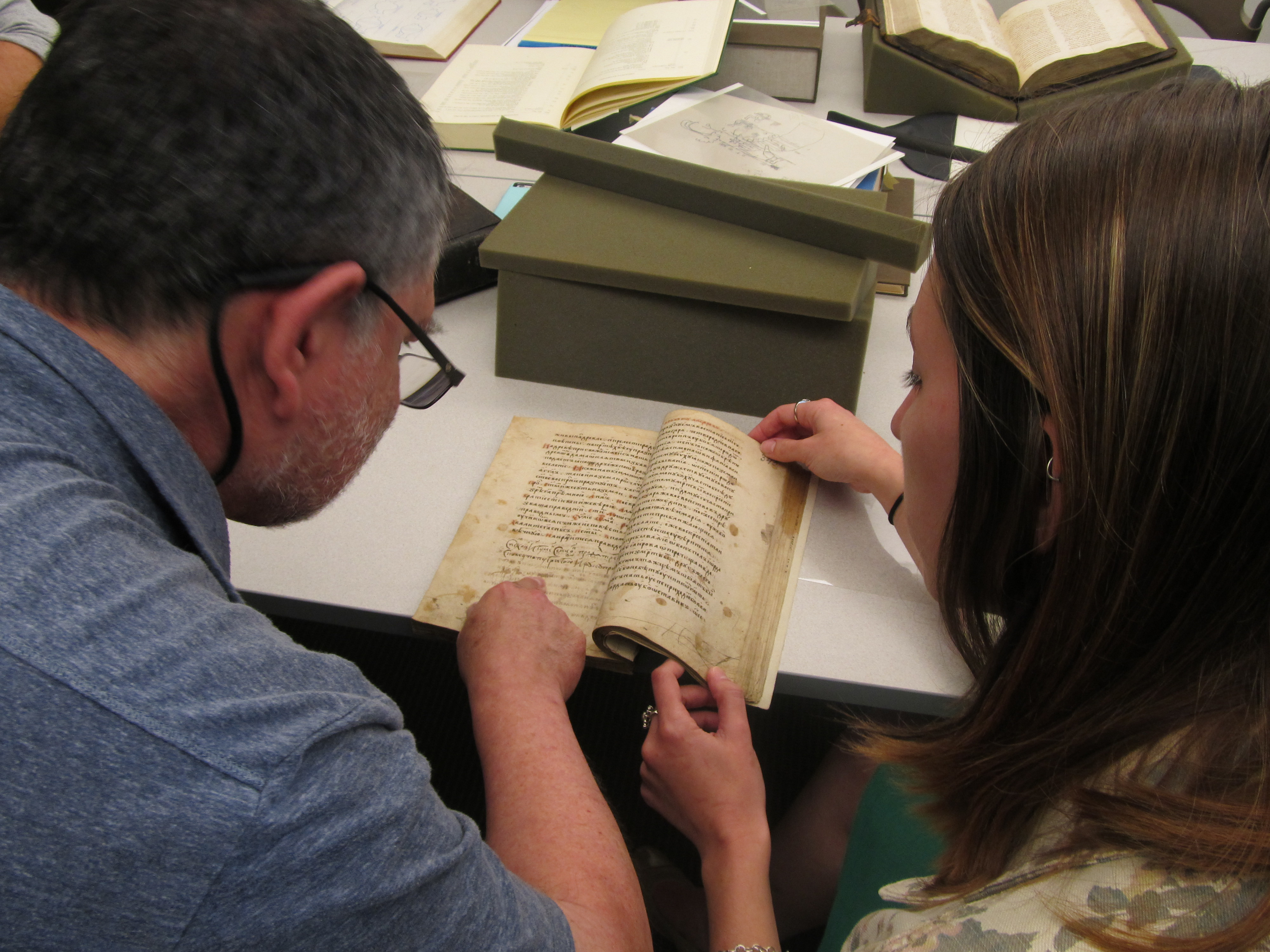 Predrag looks over manuscript with a participant