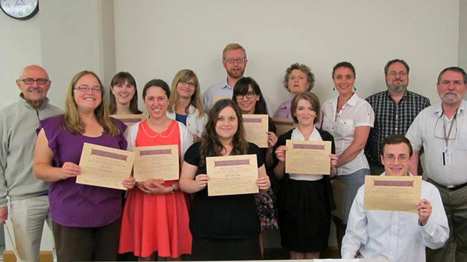 2013 participants display their certificates, received for completing the institute 